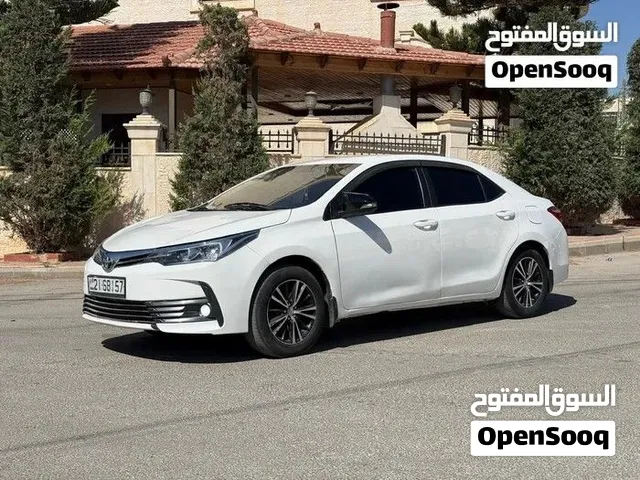 تويوتا كرولا 2015 لون ابيض لؤلؤي فحص 1جيد بسعر مغري وقابل للبدل