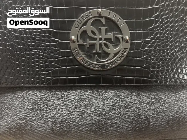 Black Guess bag used as new
