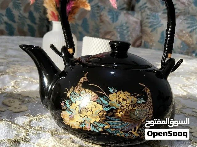 براد ديكوري أسود فاخر مزين بطاوس بالذهبي – قطعة للديكور