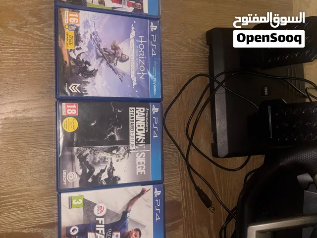 PS4 For sale with steering wheel and pedal with 4 complementary games