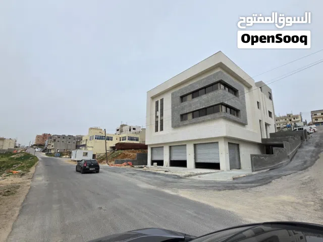 مشغل صناعي ارضي مع دخله ومشغل بدون شمع بموقع جدا مميز وبنايه حديثه جاهز اذن اشغال وماء وكهربا