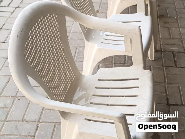 Set of 5 white Cosmoplast plastic outdoor chairs