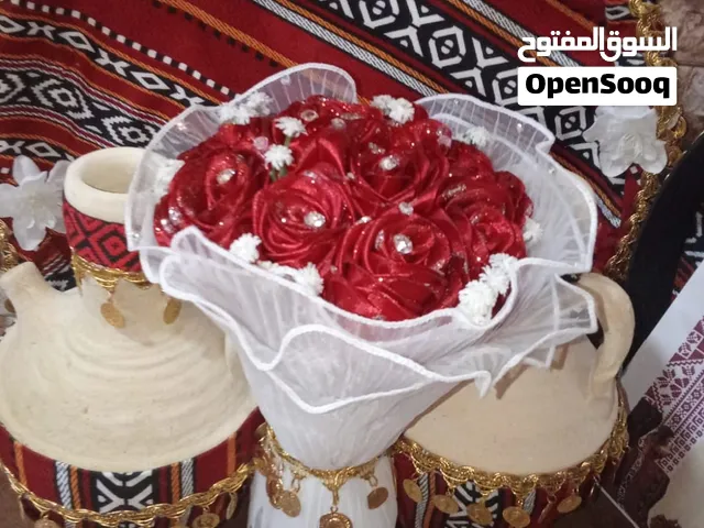 مجموعة مميزة من شغل الهاند ميد من باقات ومسكات بوكيهات ورد الساتان الرائع